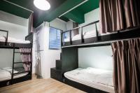 a room with two bunk beds in a hostel at We Come Hostel in Taipei
