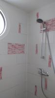 a bathroom with a shower with a shower head at Les Chênes Bleus in Sainte-Marie-de-Ré