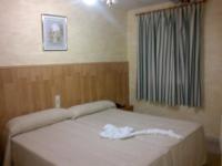 Postel nebo postele na pokoji v ubytování Hostal Mays