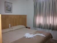 Postel nebo postele na pokoji v ubytování Hostal Mays