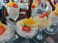 a group of desserts in glasses on a table at Rajarata Hotel Anuradhapura in Anuradhapura