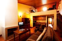 a living room with a couch and a fireplace at Parador Casa Da Insua in Penalva do Castelo