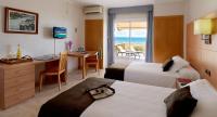 A bed or beds in a room at Aparthotel Solifemar