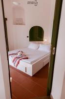 A bed or beds in a room at Terrazza Diomede- Manfredi Homes & Villas