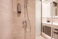 a bathroom with a shower and a sink at CityInn Hotel Plus- Fuxing North Road Branch in Taipei