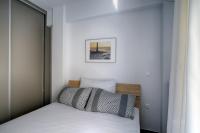 Posteľ alebo postele v izbe v ubytovaní Heliconia deluxe Apt Must