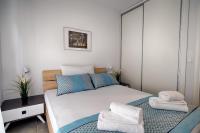 Posteľ alebo postele v izbe v ubytovaní Heliconia deluxe Apt Must