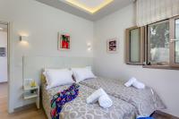 Posteľ alebo postele v izbe v ubytovaní Superior Villa Marina Mare Sauna Hammam