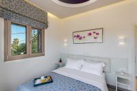 Posteľ alebo postele v izbe v ubytovaní Superior Villa Marina Mare Sauna Hammam