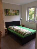 a bedroom with a bed with a green mattress at Bergcafè - Hotel Kammann in Essen