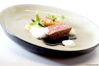 a plate of food with meat and cheese on it at Kameha Grand Bonn in Bonn