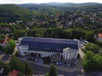 an overhead view of a building with solar panels on it at Calimbra Wellness Hotel Superior in Miskolctapolca