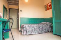 Posteľ alebo postele v izbe v ubytovaní Hotel Eden