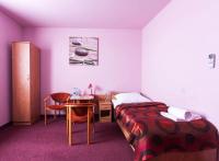 Łóżko lub łóżka w pokoju w obiekcie Hotel Paola
