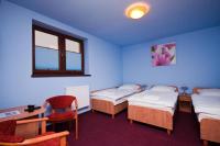 Łóżko lub łóżka w pokoju w obiekcie Hotel Paola