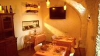 A television and/or entertainment centre at New Arcobaleno Ossegna