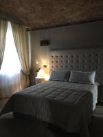 Łóżko lub łóżka w pokoju w obiekcie Corte degli Angeli Agriturismo