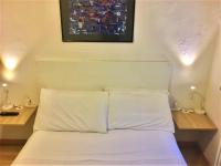 A bed or beds in a room at Appartamento Maggiore