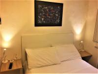 A bed or beds in a room at Appartamento Maggiore