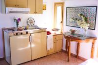 A kitchen or kitchenette at Vamos Palace Apartments