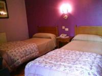 A bed or beds in a room at Hotel Solpor