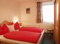 A bed or beds in a room at Haus Elfi