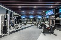 a gym with several treadmills and cardio machines at The Tango Taichung in Taichung