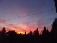 The sunrise or sunset as seen from a vendégházakat or nearby