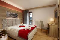 Posteľ alebo postele v izbe v ubytovaní Tevini Dolomites Charming Hotel