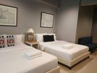 Postel nebo postele na pokoji v ubytování Loft 21 Apartment Romklao