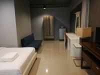 Postel nebo postele na pokoji v ubytování Loft 21 Apartment Romklao