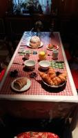 a table topped with different types of pastries and pies at Chambre d&#39;Hôtes &quot;Au Vigneron&quot; in Triembach-au-Val