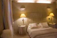 Łóżko lub łóżka w pokoju w obiekcie Corte degli Angeli Agriturismo