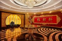 a living room with a chandelier and a table at The Reverie Saigon in Ho Chi Minh City