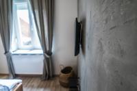 Televízia a/alebo spoločenská miestnosť v ubytovaní Apartments Industrial Nordic Zagreb