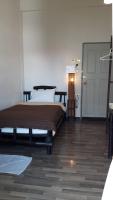 Postel nebo postele na pokoji v ubytování Lamphuhouse Bangkok