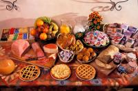 a table topped with lots of different types of food at Hotel Santa Maria in Rome