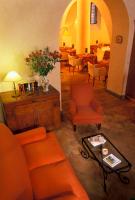 a living room with an orange couch and a table at Hotel Santa Maria in Rome