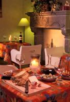 a table with a candle and food and wine glasses at Hotel Santa Maria in Rome