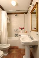a bathroom with a sink and a toilet and a shower at Hotel Santa Maria in Rome