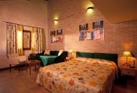 a bedroom with a bed and a couch at Hotel Santa Maria in Rome