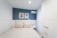 A bed or beds in a room at Apartamentos Diaber Gerona 22