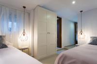 A bed or beds in a room at Apartamentos Diaber Gerona 22