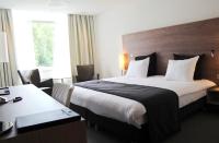 Ein Bett oder Betten in einem Zimmer der Unterkunft Sanadome Hotel & Spa Nijmegen