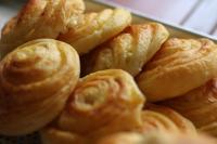 a pile of croissants sitting on a plate at Long Life Riverside Hotel in Hoi An