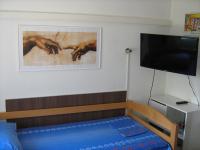 Televízia a/alebo spoločenská miestnosť v ubytovaní Apartman Paro