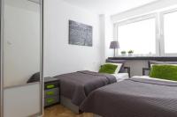 Posteľ alebo postele v izbe v ubytovaní Apartament Świętokrzyska