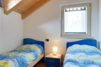 A bed or beds in a room at Apartment Valdisole