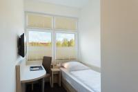 Postel nebo postele na pokoji v ubytování Viva Hotel Lübeck