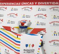 a sign with the names of the different universal american symbols at Hotel del Juguete in Ibi